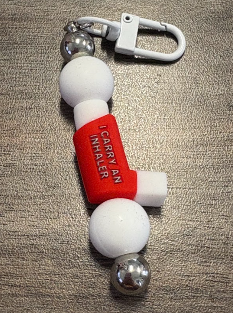 Red inhaler bag clip/keychain on white