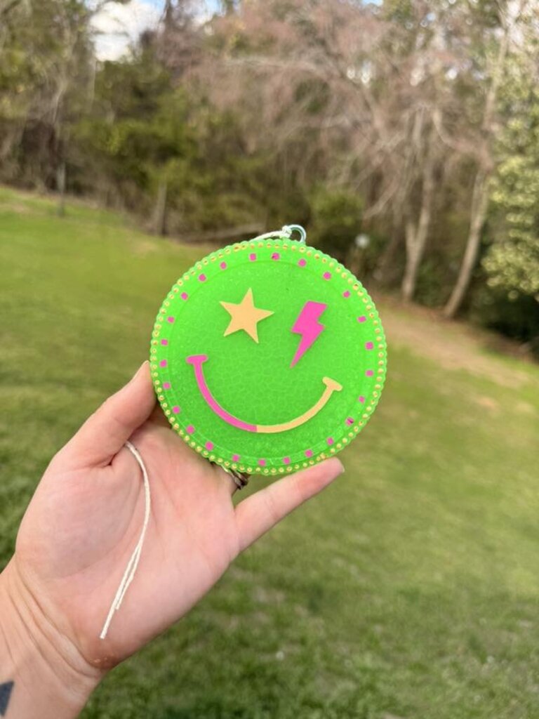 Green smiley dot