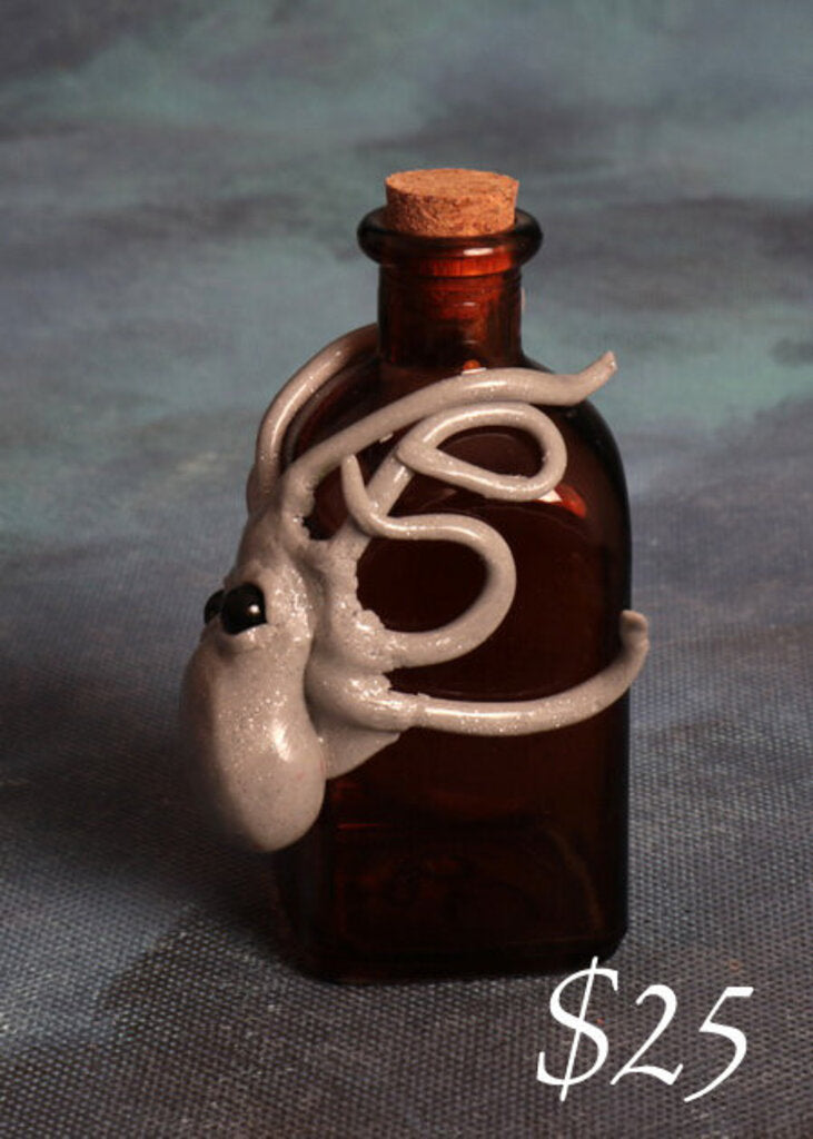 Small polymer clay octopus on bottle