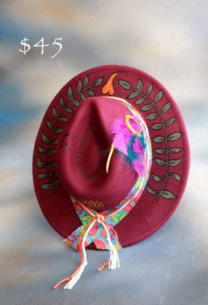 Burgundy cowboy hat with pyrographed/painted design of vine and paisley (CJ)