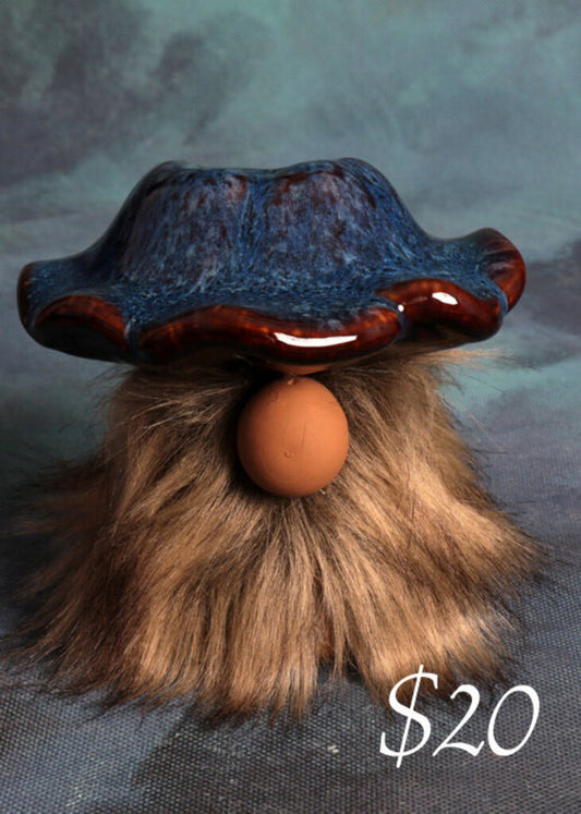 Mushroom gnome with blue hat and beige beard